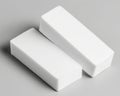Two White Porous Rectangular Objects on Gray Background Royalty Free Stock Photo
