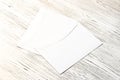 Two white postal envelopes on a wooden table. Abstract background for design Royalty Free Stock Photo