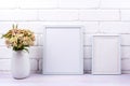 Two white poster frames mockup with pink yarrow Royalty Free Stock Photo