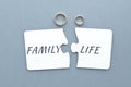 two white puzzles with the separated word family life, two wedding rings on a gray-blue Royalty Free Stock Photo