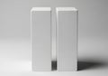 Two white rectangular blocks standing upright on a flat surface Royalty Free Stock Photo