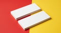 Two white rectangular boxes are placed on a background divided into red and