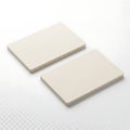 Two white rectangular objects on a clean surface Royalty Free Stock Photo
