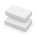 Two white rectangular objects stacked at an angle against a plain background Royalty Free Stock Photo
