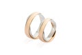 Two white and rose gold wedding rings isolated on white background Royalty Free Stock Photo