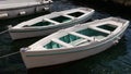 Two white rowing boats moored in a harbour Royalty Free Stock Photo