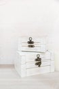 two white secret wooden boxes on table with white background