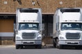 Semi tractor trailer trucks at a loading dock Royalty Free Stock Photo