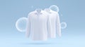 Two white shirts displayed against a soft blue background with bubbles, showcasing a clean and fresh appearance, ideal Royalty Free Stock Photo