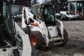 Two white skid steer loader at a construction site waiting of work. Industrial machinery. Industry. Royalty Free Stock Photo