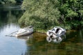 Two white small shipwrecks in shoal of the River Leven in Baloch, Scotland Royalty Free Stock Photo