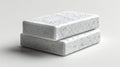 Two white speckled rectangular blocks on a white surface Royalty Free Stock Photo