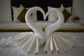 Two white swans made of towels in a hotel in Thailand, Asia