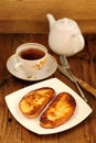 Two white toasts on white plate with cup of black tea Royalty Free Stock Photo