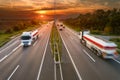 Two white trucks in motion blur on the highway Royalty Free Stock Photo