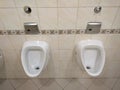 Two White urinal, pissoir on wall