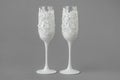 Two white wedding wine glasses decorated with lace and pearls Royalty Free Stock Photo
