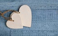 Two white wooden hearts on on a blue background.Valentine`s Day greeting card.Love,romantic or wedding concept with space for text Royalty Free Stock Photo