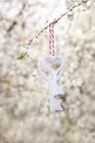 Two White wooden keys hanging on a blossoming cherry branch. Love, spring symbol. Concept for Valentine`s Day, wedding, engagemen Royalty Free Stock Photo