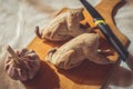 Two whole boiled quails lie on a cutting board as an example of diet food Royalty Free Stock Photo