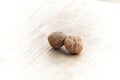 Two whole delicious brown walnuts on light wood Royalty Free Stock Photo