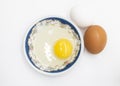 Two whole eggs and one broken isolated on a white background Royalty Free Stock Photo