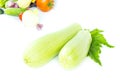 Two whole fresh green ripe zucchini or courgettes, object isolated on white background with vegetables