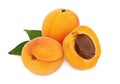 Two whole and a half apricot with leaves (isolated) Royalty Free Stock Photo