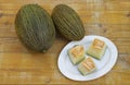 Sharlyn melon  on a rustic wooden table Royalty Free Stock Photo