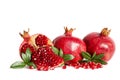 Two whole Pomegranates and two parts of Pomegranate with leaves and seeds Royalty Free Stock Photo