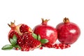 Two whole Pomegranates and two parts of Pomegranate with leaves Royalty Free Stock Photo