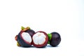 Two whole purple mangosteen and two cross section isolated on white background. Tropical fruit from Thailand. The queen of fruits