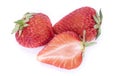 Two whole ripe strawberries and one half on a white background Royalty Free Stock Photo