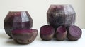 Two whole and sliced beetroot, geometrically shaped, on a white surface Royalty Free Stock Photo