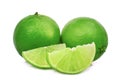 Two whole and slices fresh green lime isolated on white Royalty Free Stock Photo