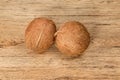 Two whole uncut coconuts Royalty Free Stock Photo