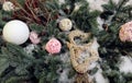 Two wicker hearts among Christmas balls and spruce branches, top view, close-up Royalty Free Stock Photo