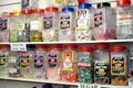 Two shelves of wrapped sugar free boiled sweets in glass jars