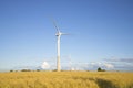 Two wind power generator on the field on a summer evening Royalty Free Stock Photo