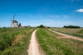 Two windmills on a along the polder near Maasland, the Neth Royalty Free Stock Photo