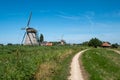 Two windmills on a along the polder near Maasland, the Neth Royalty Free Stock Photo