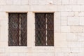 Two window with a medieval-style grille Royalty Free Stock Photo