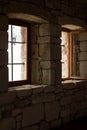 Two windows on a brick wall inside a dark construction Royalty Free Stock Photo