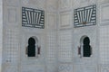 Two windows of mosque with fire alarm Royalty Free Stock Photo