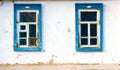 Two windows old clay wall Royalty Free Stock Photo