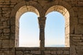 Two windows in an old tower or fortress, view from the inside Royalty Free Stock Photo