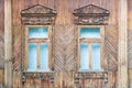 Two windows in an old wooden russian house