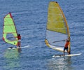 Two windsurfer the ocean - the coach and pupil