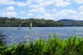 Two windsurfers struggling with a strong wind Royalty Free Stock Photo