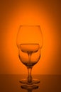 Two wine glass on orange background